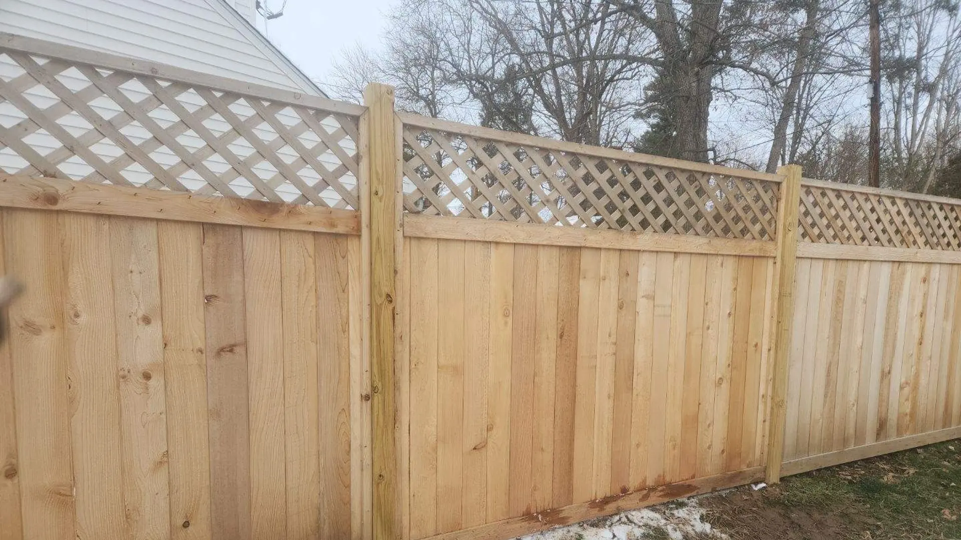 Cedar privacy fence with lattice top installed by JHL Fence in Wynnewood, PA